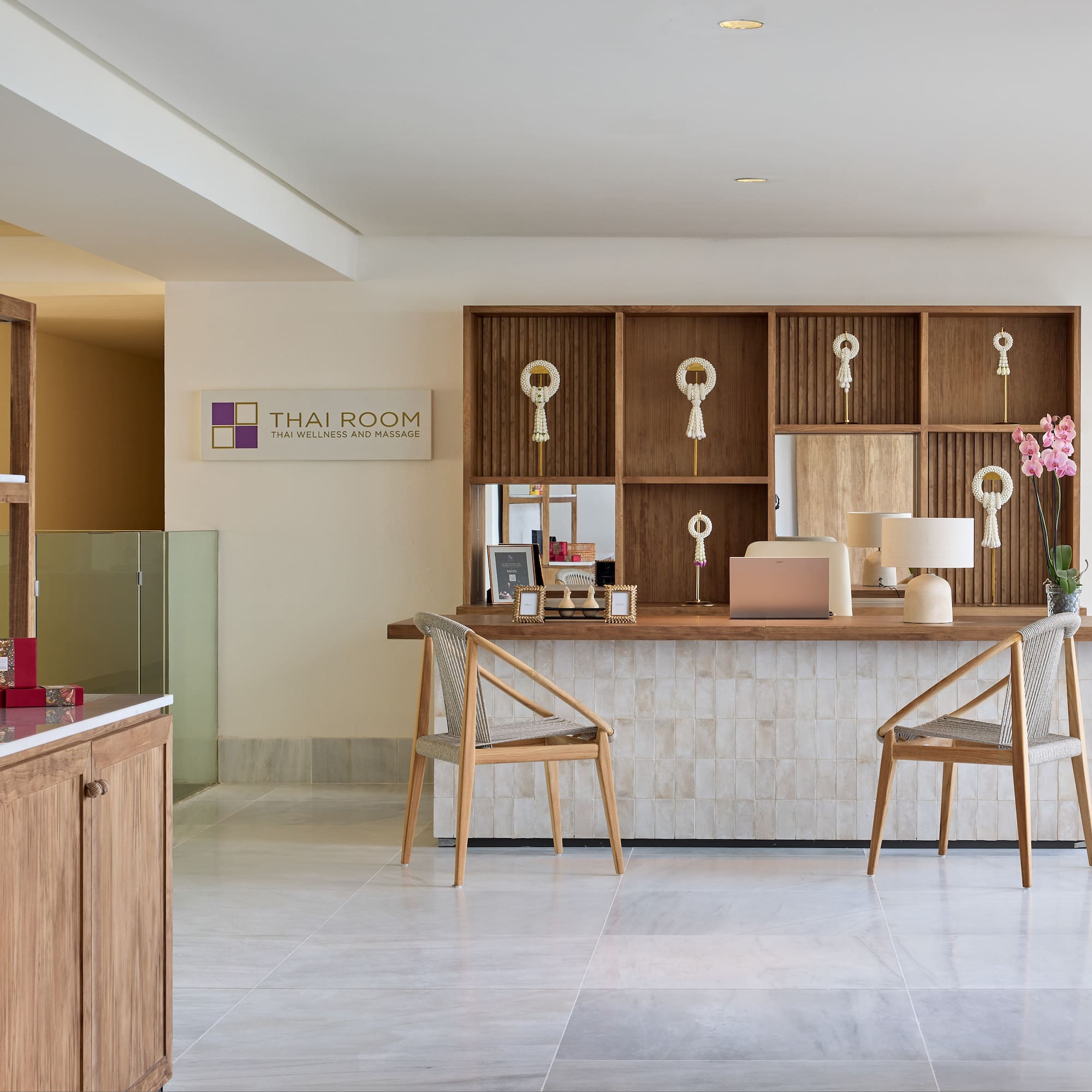 a room with a desk and chairs