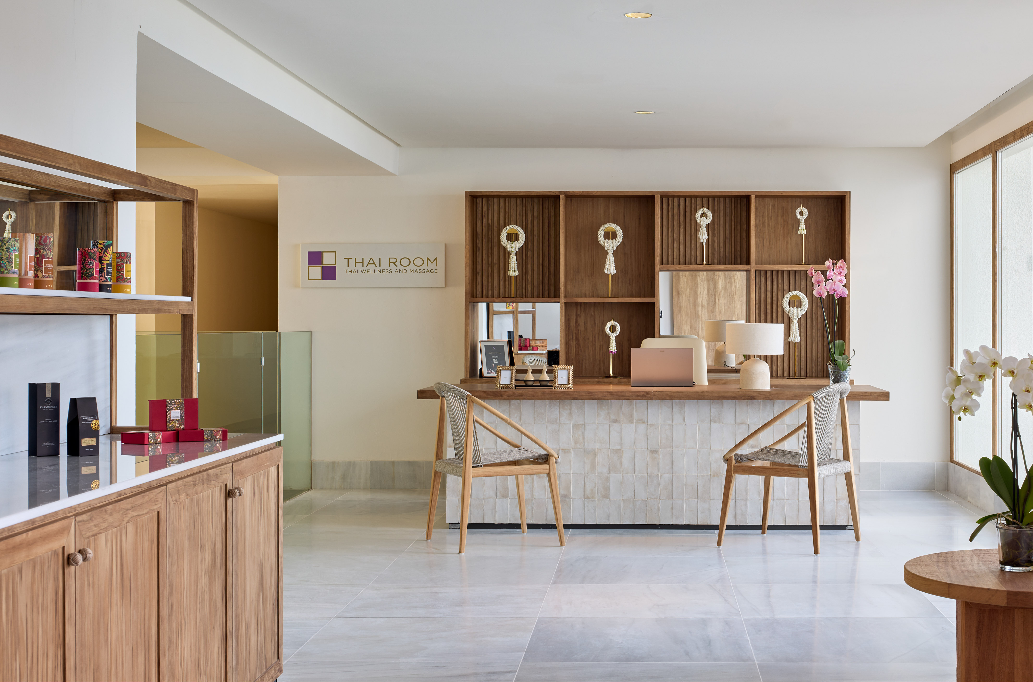 a room with a desk and chairs