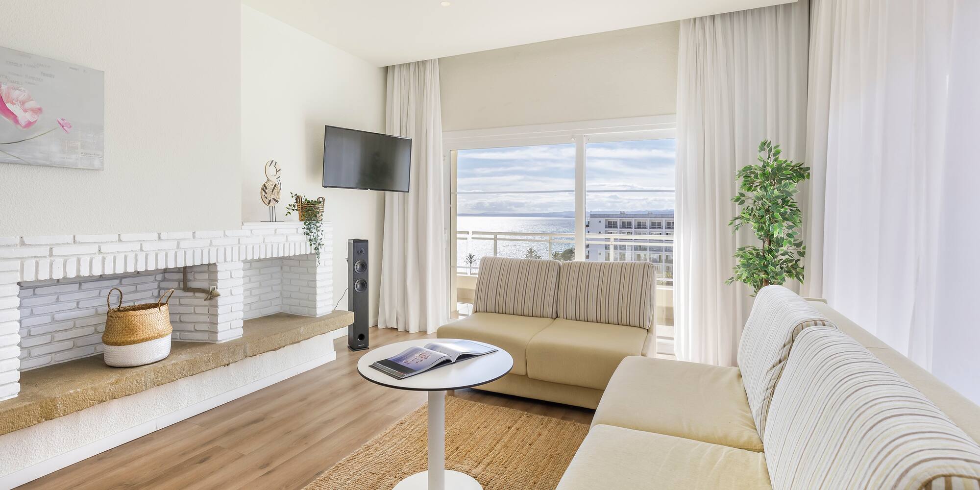 a living room with a fireplace and couches