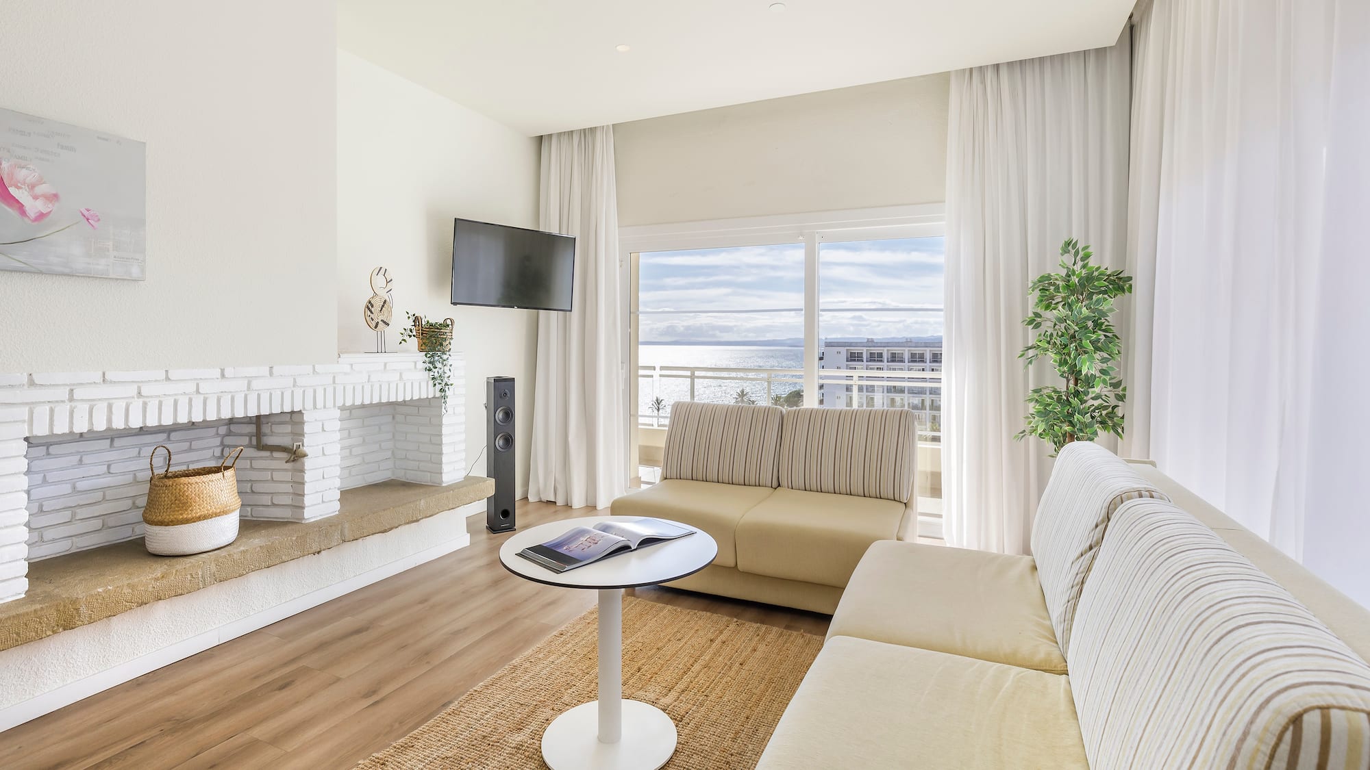 a living room with a fireplace and couches