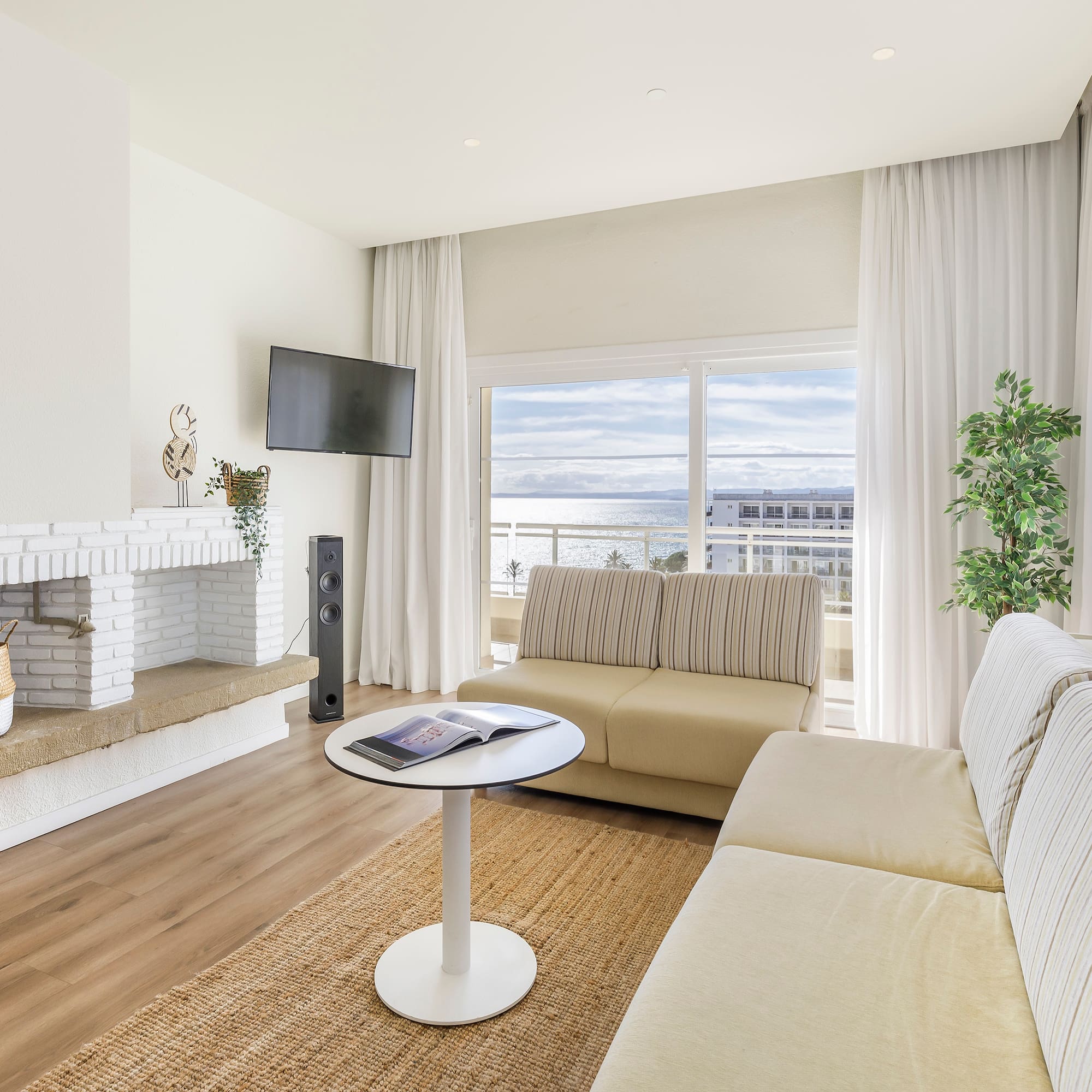 a living room with a fireplace and couches