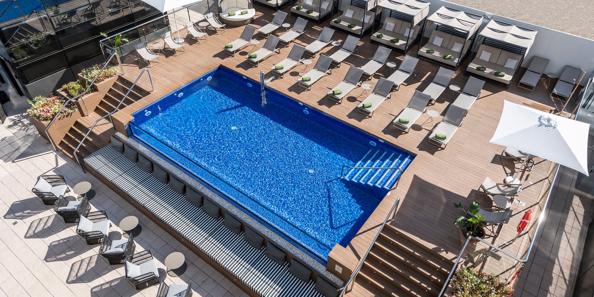 a pool with chairs and a deck