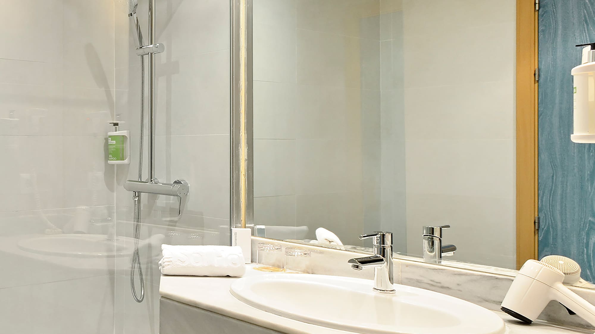 a bathroom with a shower and sink