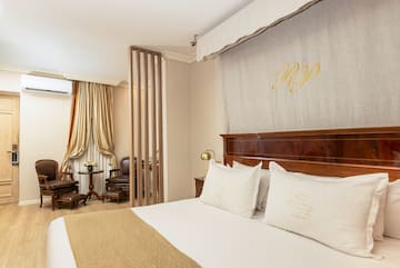 a bed with pillows in a room