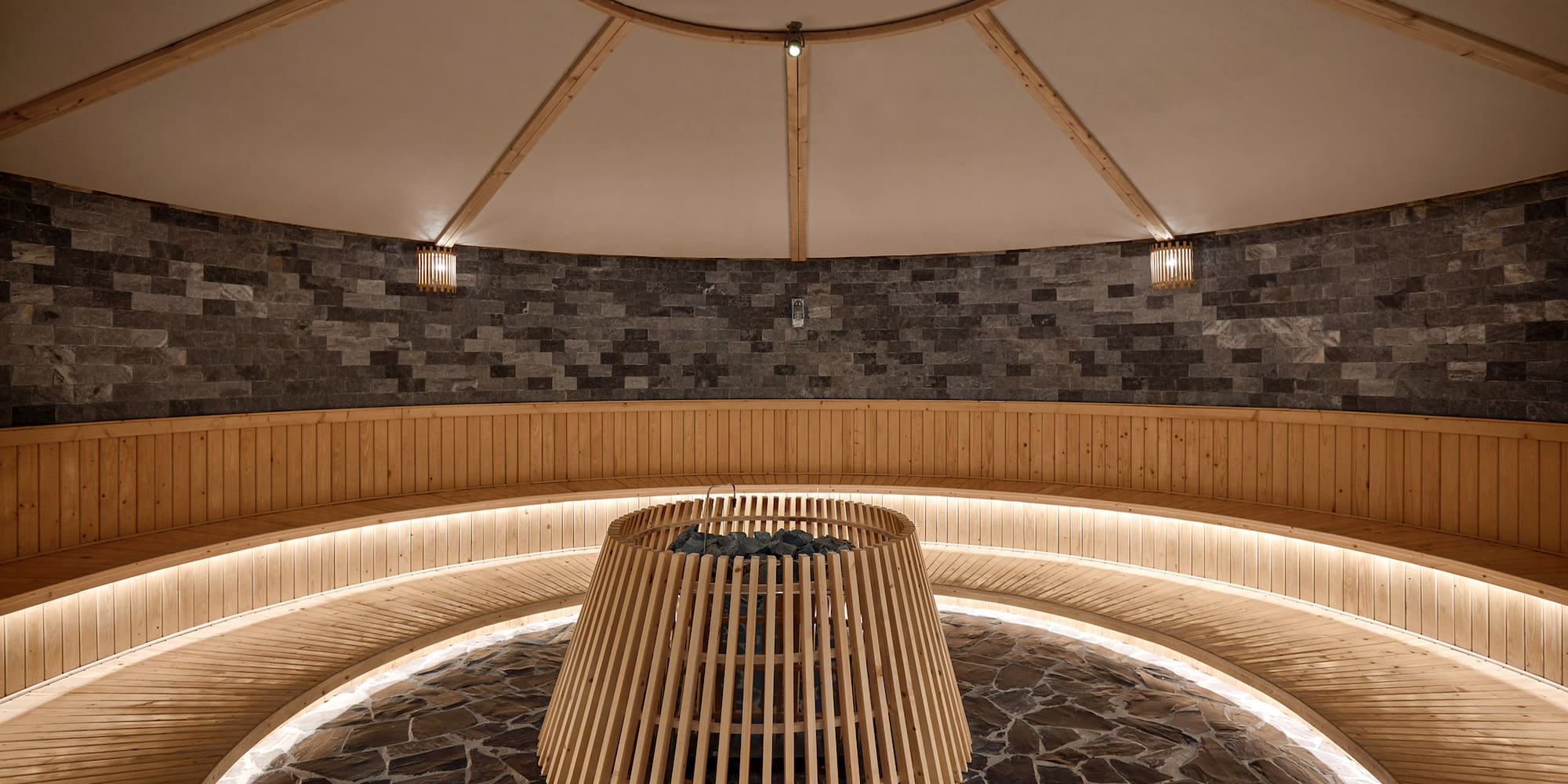 a round wooden structure with lights