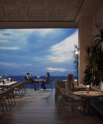 a group of people sitting at tables in a restaurant