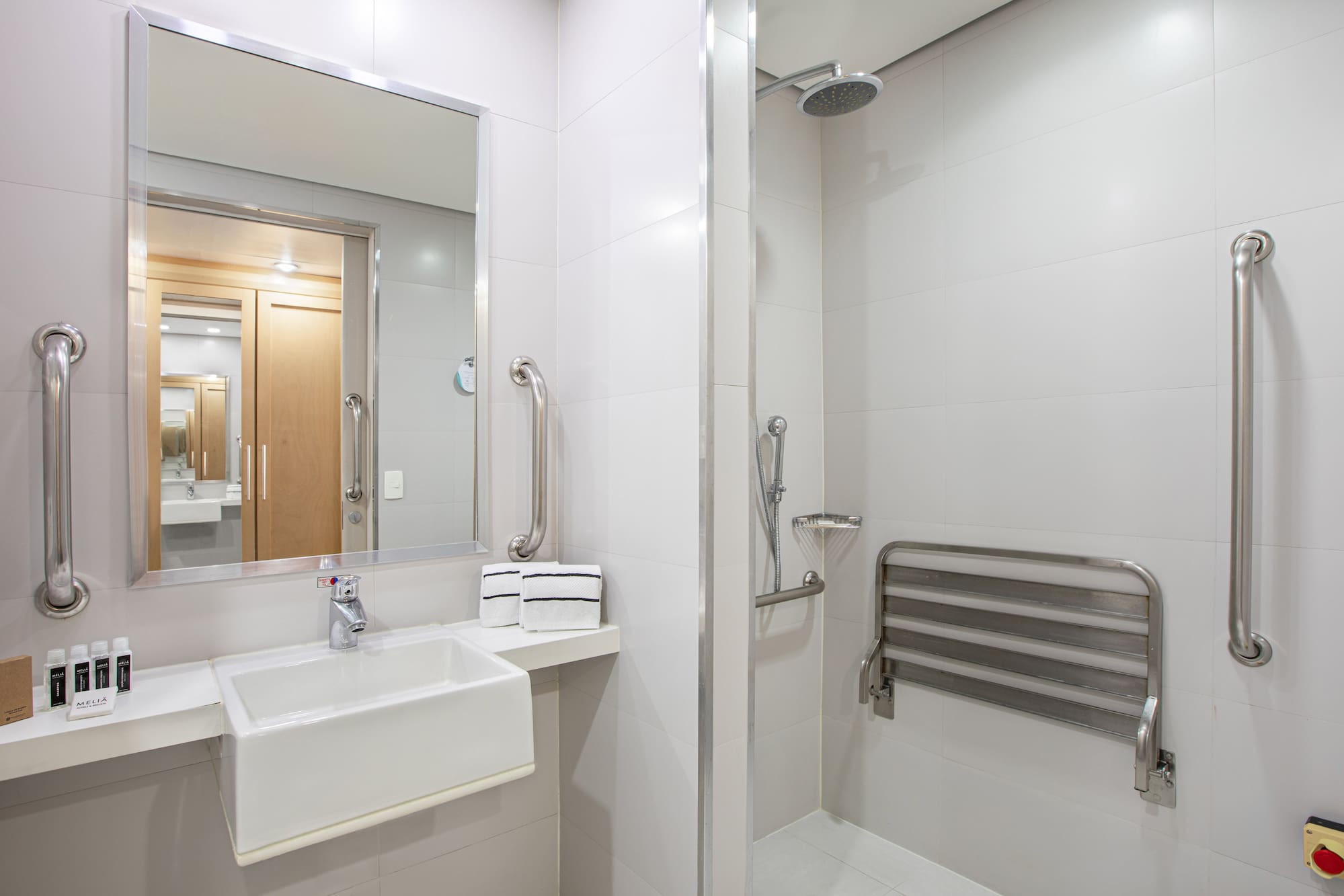 a bathroom with a shower and sink