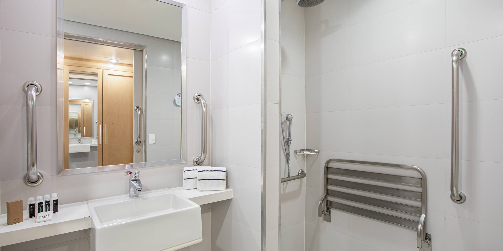 a bathroom with a shower and sink