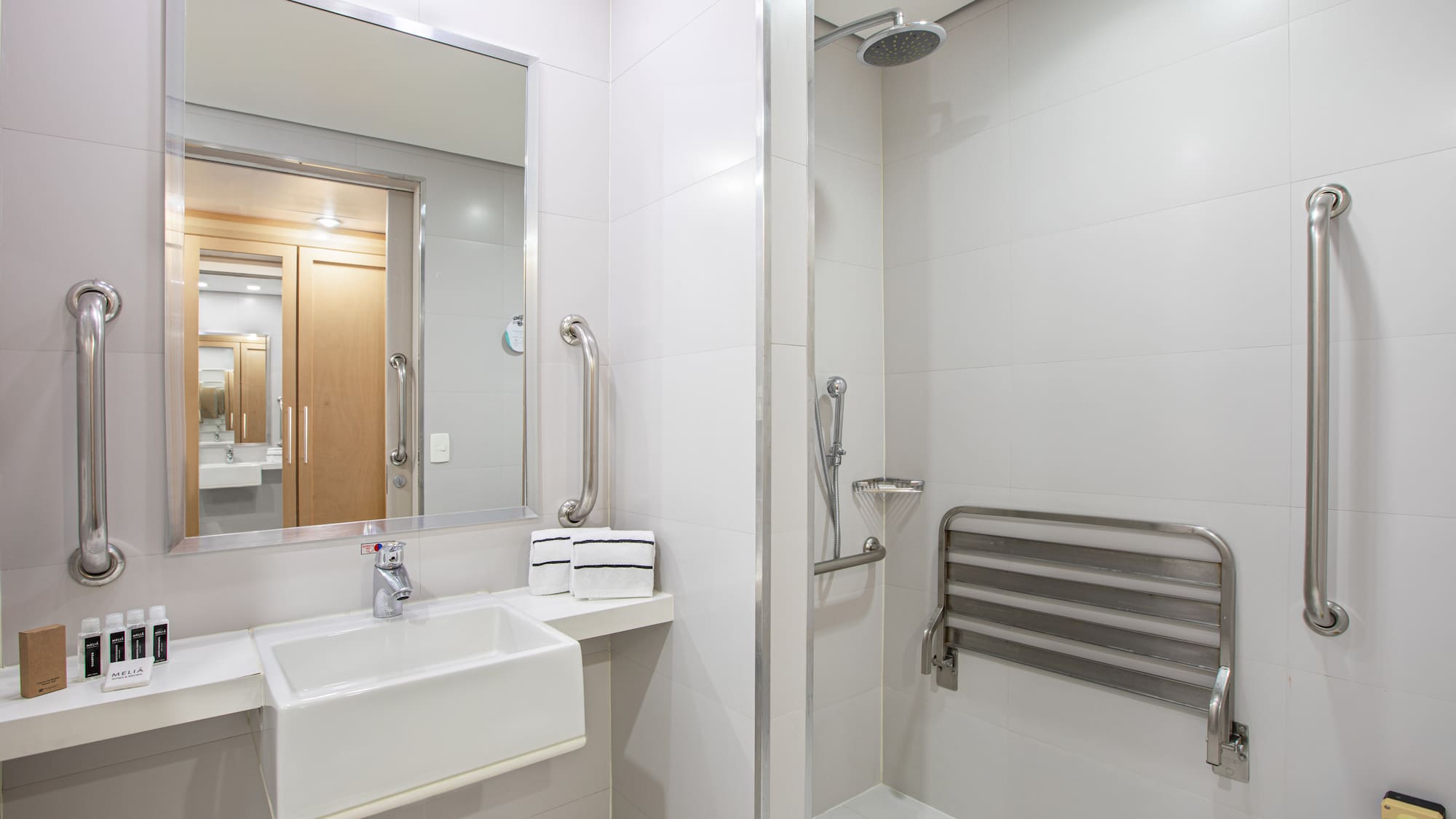 a bathroom with a shower and sink