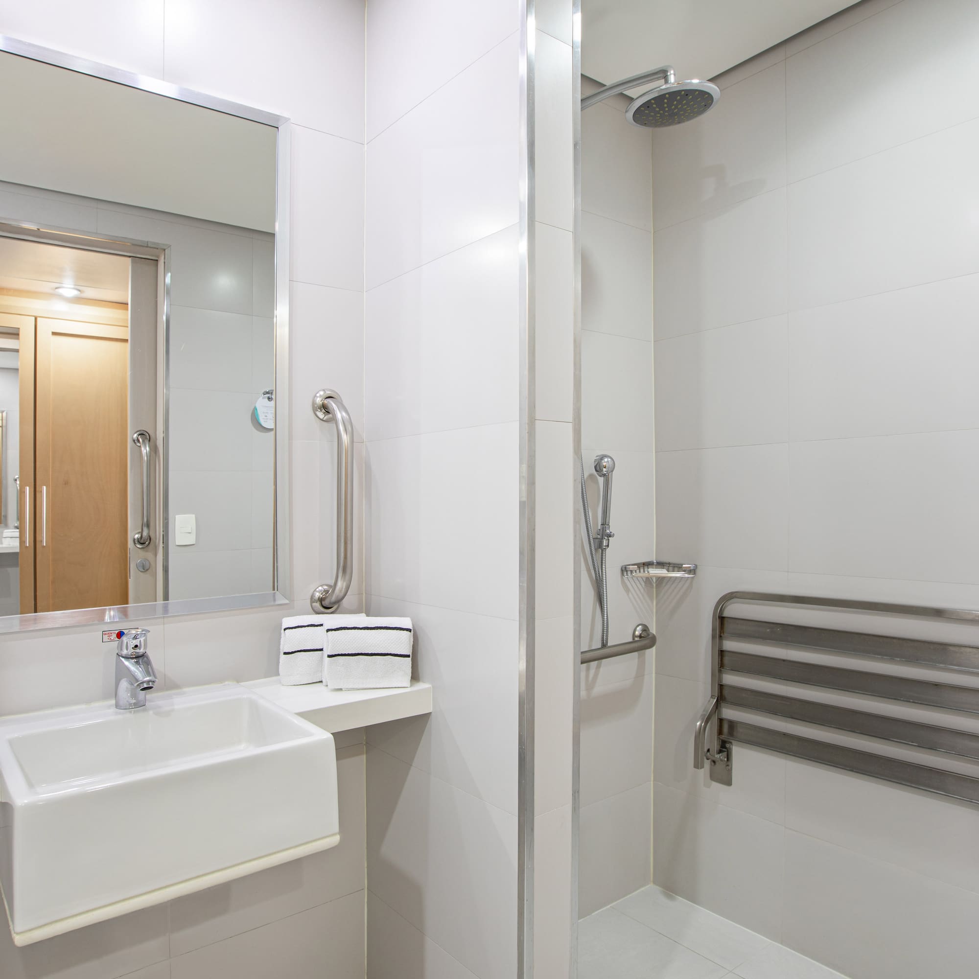 a bathroom with a shower and sink