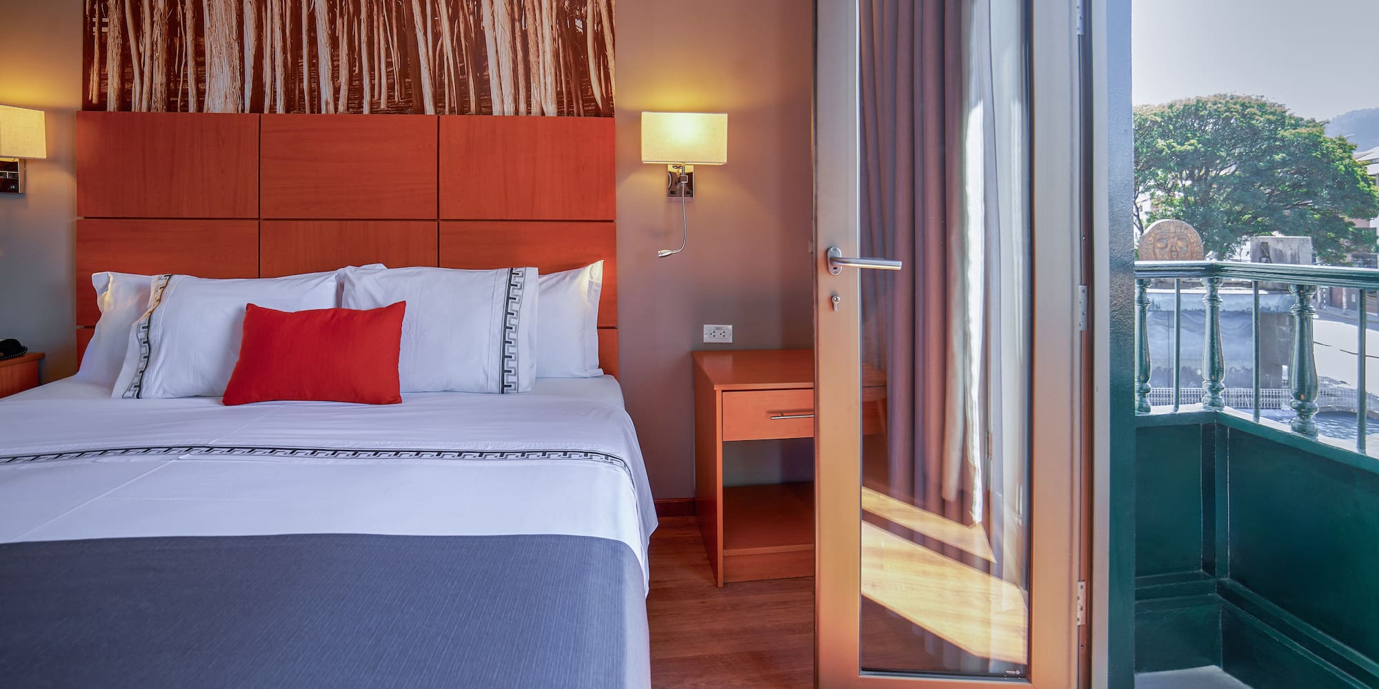 a bed with a glass door