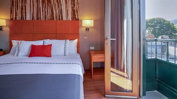 a bed with a glass door