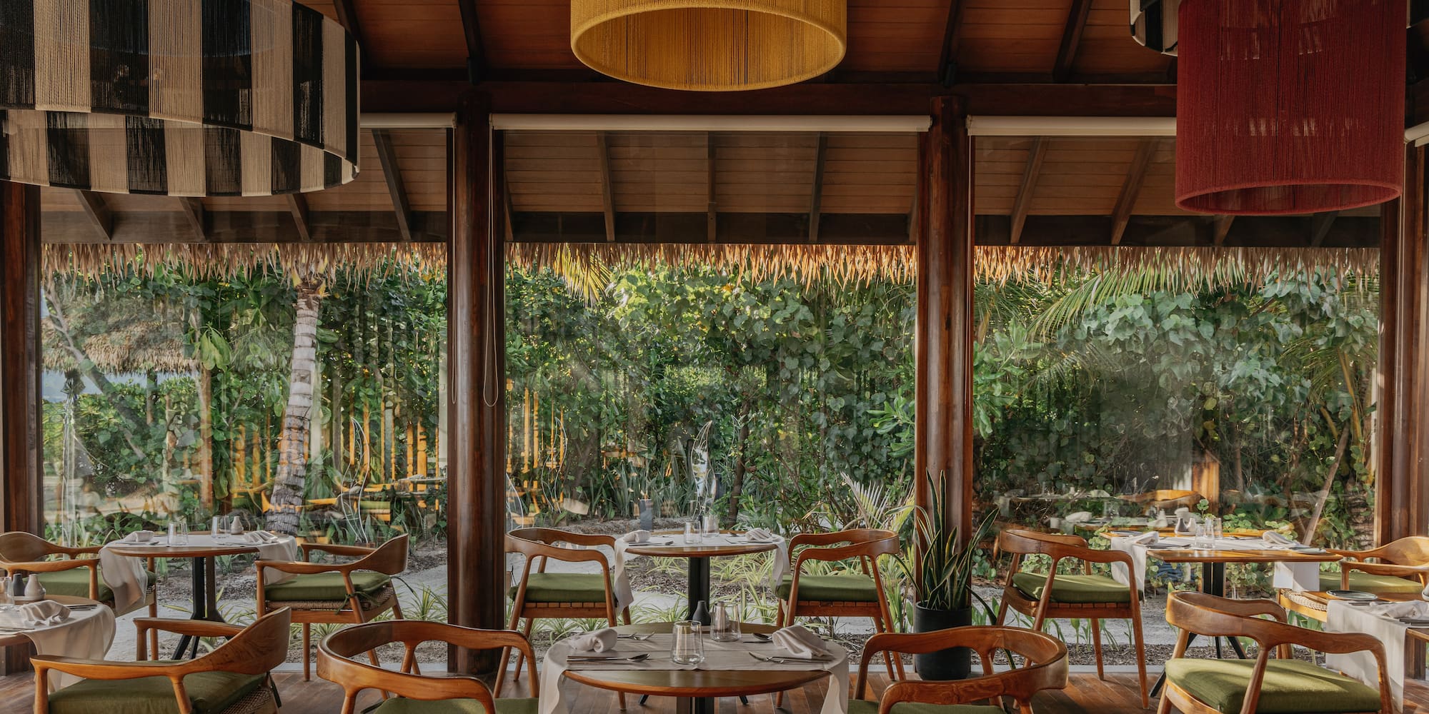 a restaurant with tables and chairs