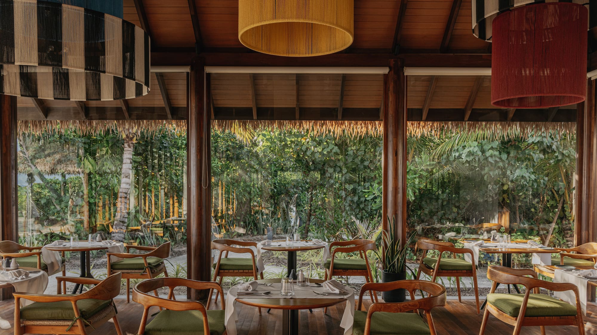 a restaurant with tables and chairs