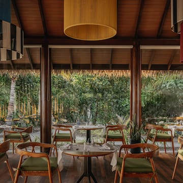 a restaurant with tables and chairs
