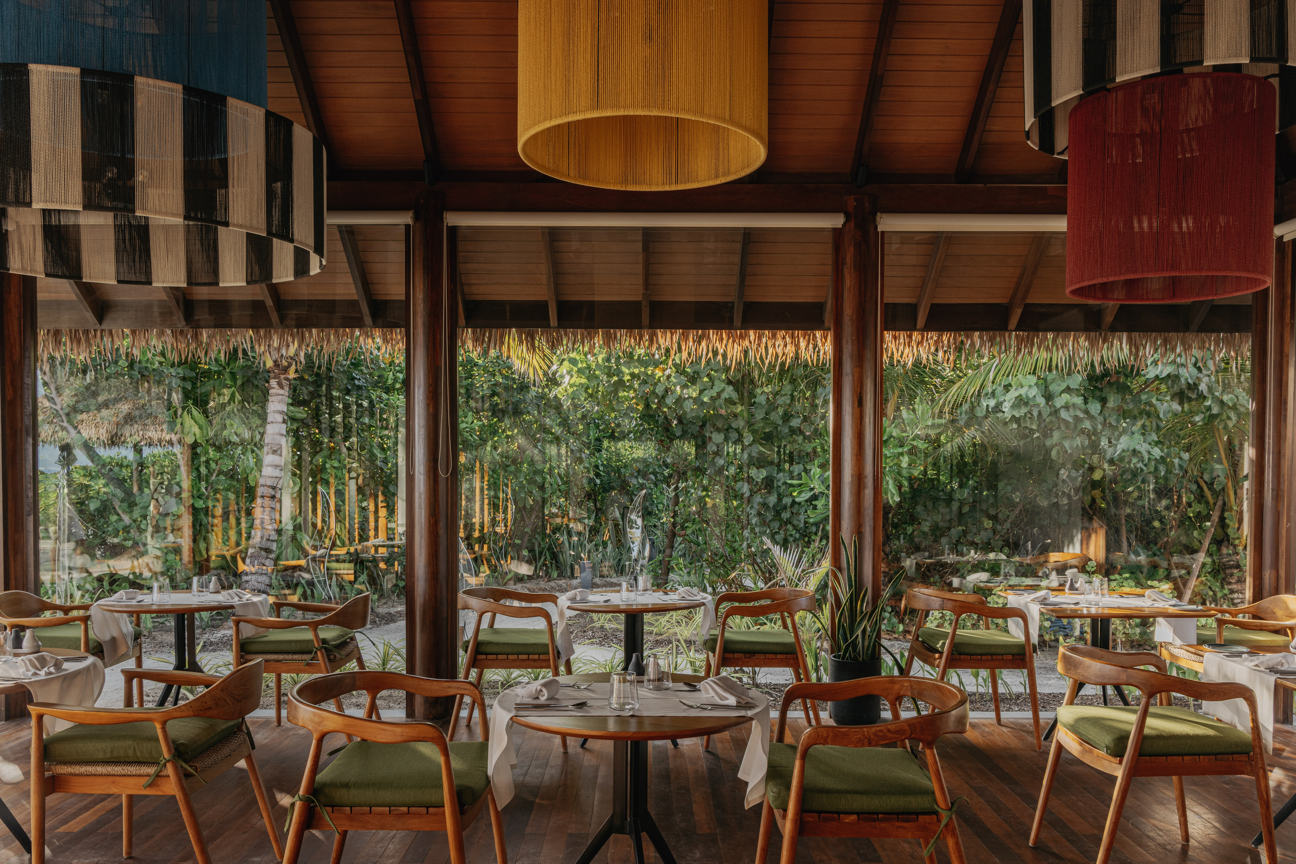 a restaurant with tables and chairs