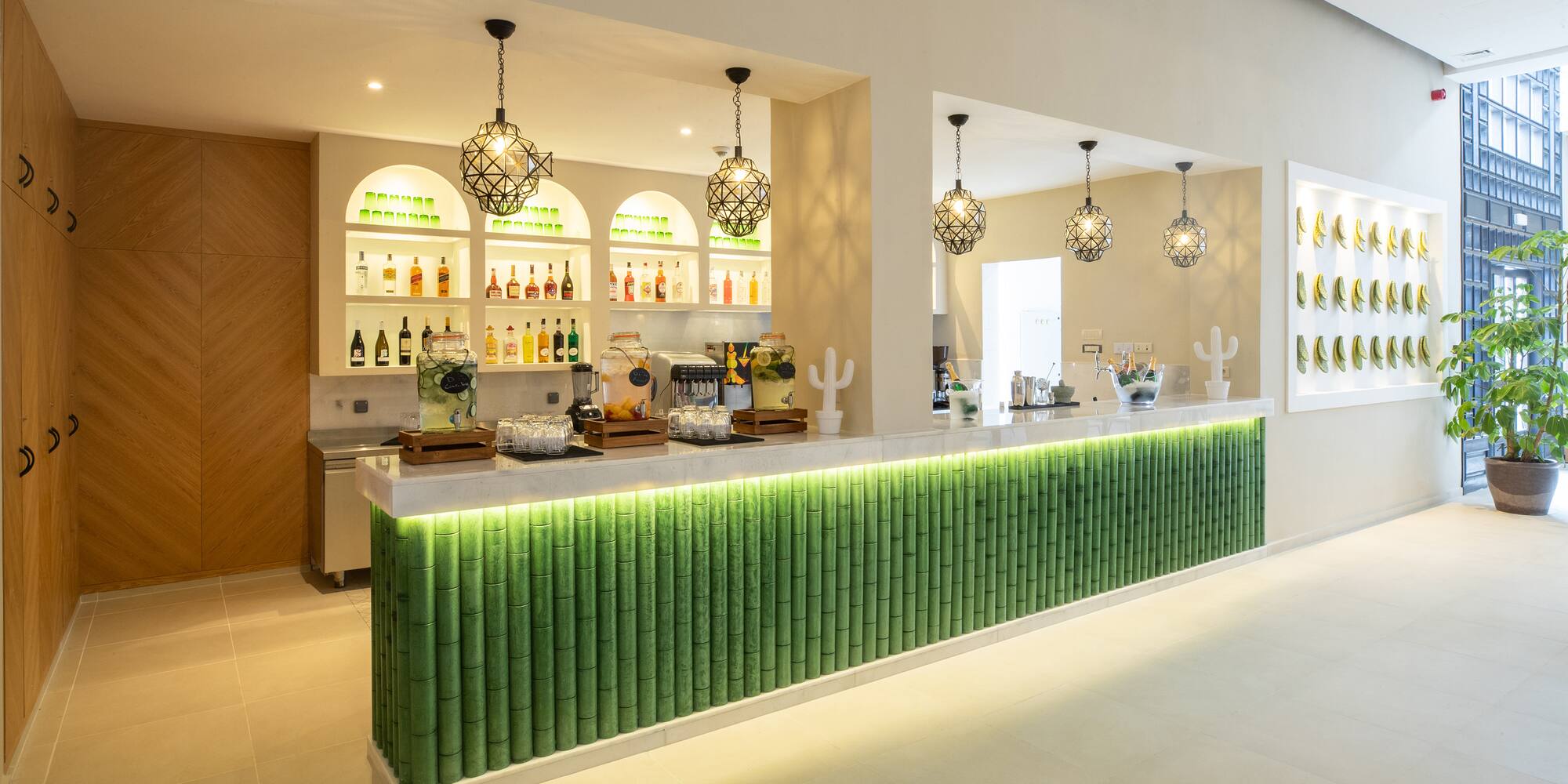 a bar with green and white bamboo walls