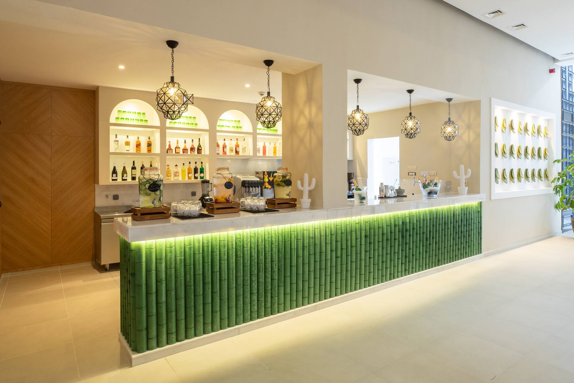 a bar with green and white bamboo walls