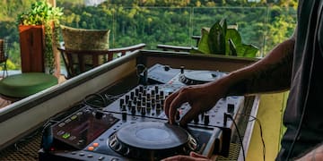 a man playing music on a deck