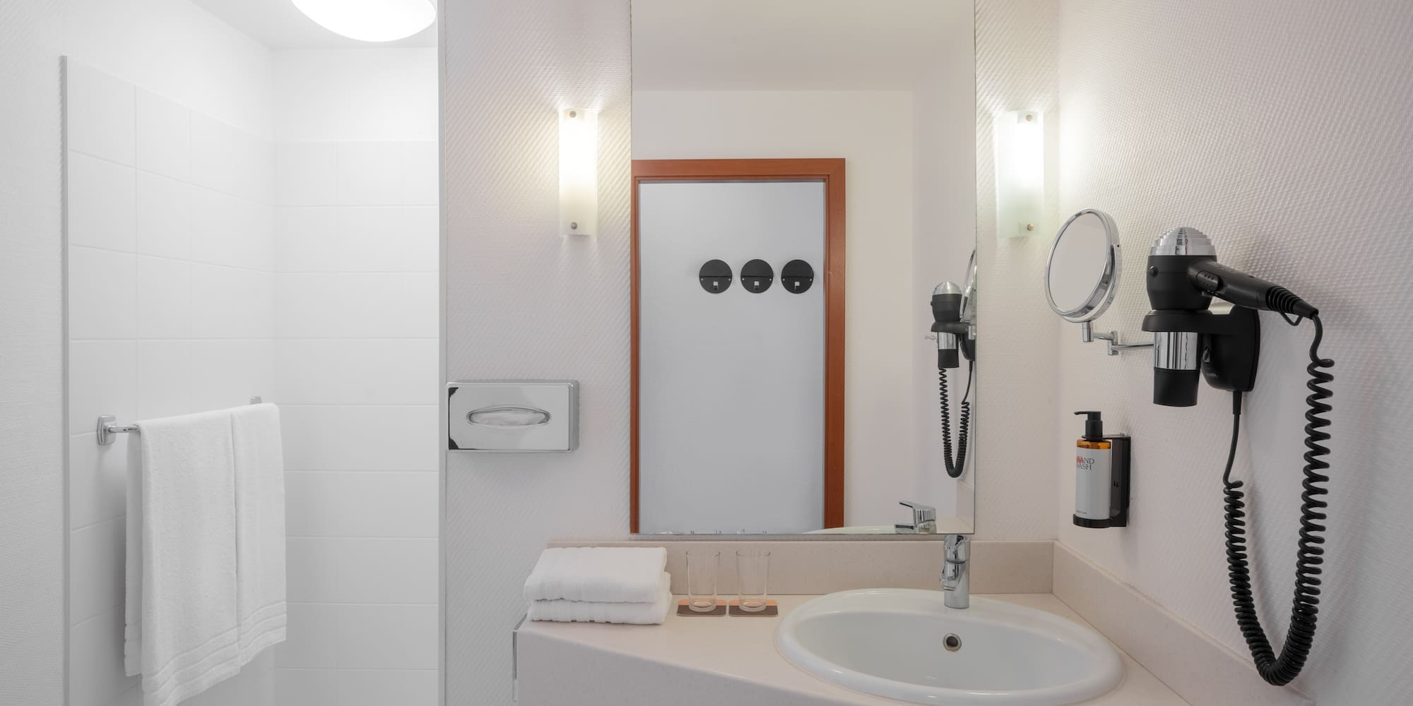 a bathroom with a mirror and a sink