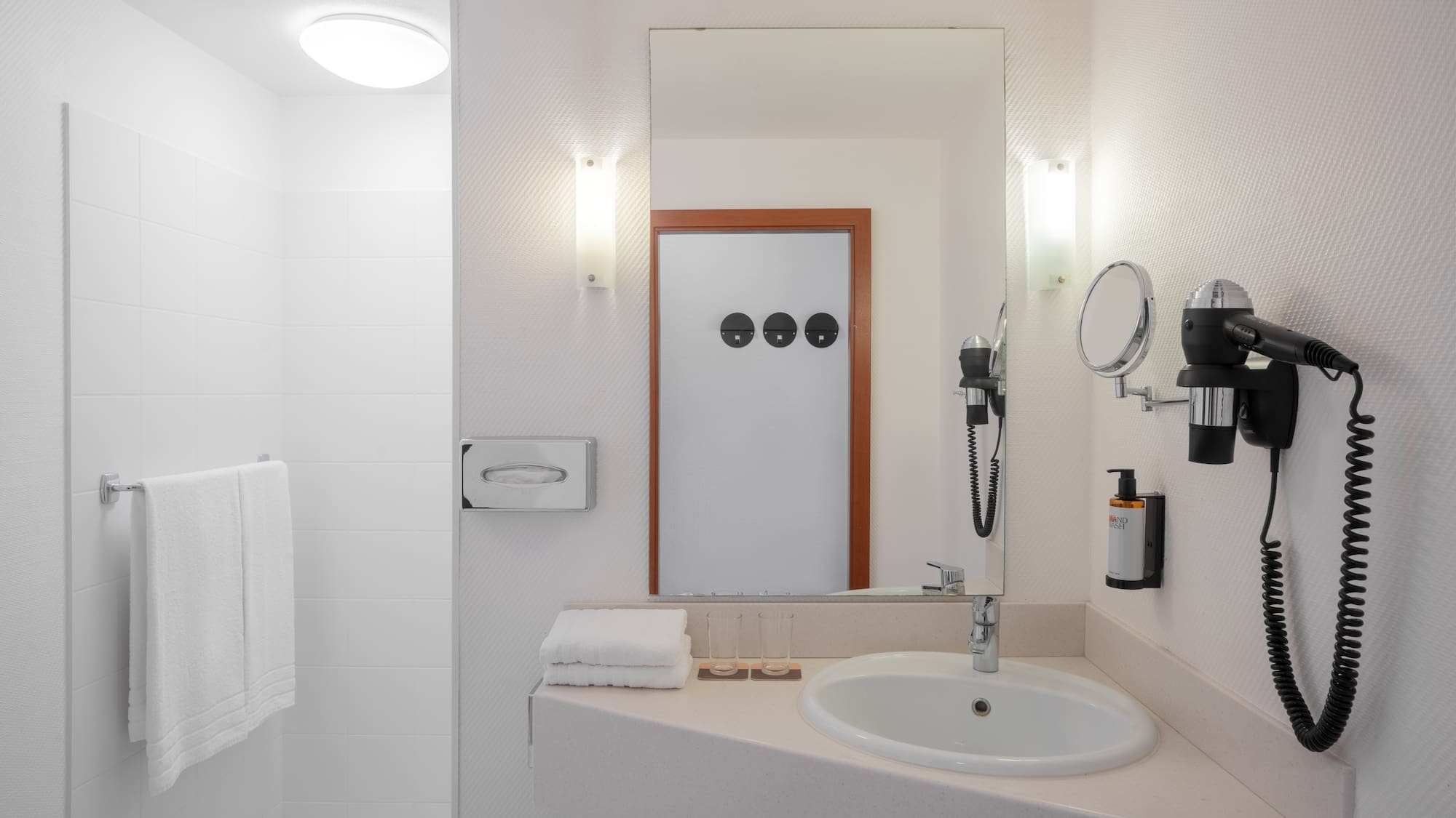 a bathroom with a mirror and a sink