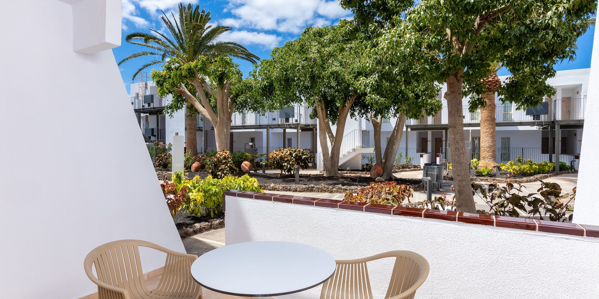 a table and chairs outside of a hotel