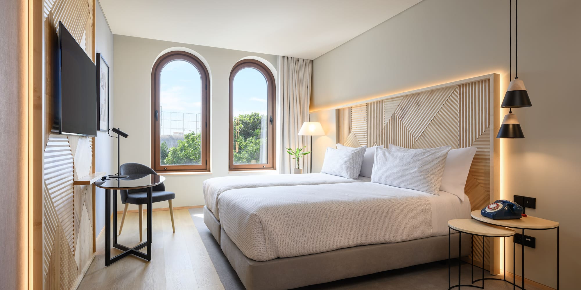 a bedroom with a bed and a table