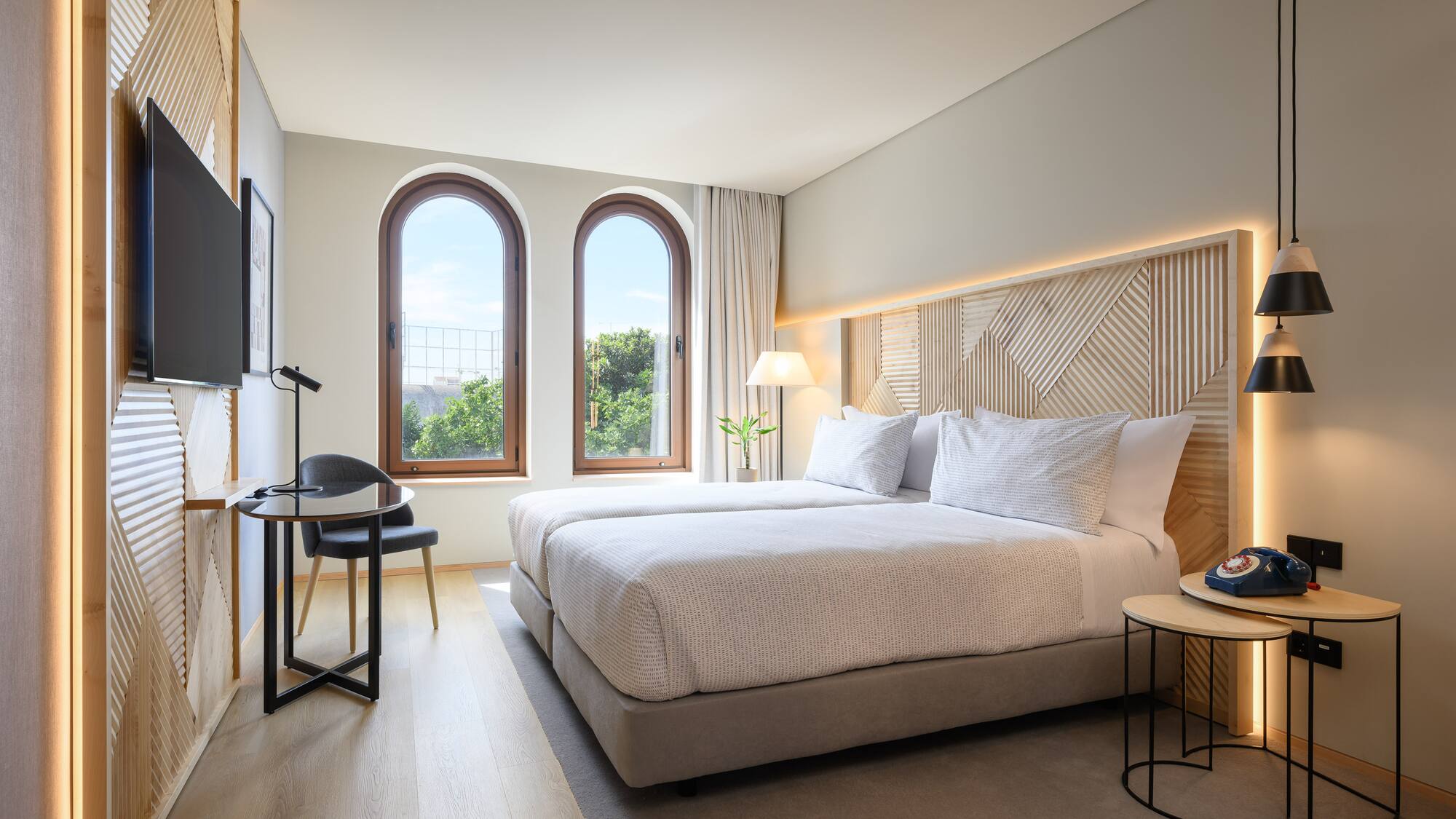 a bedroom with a bed and a table