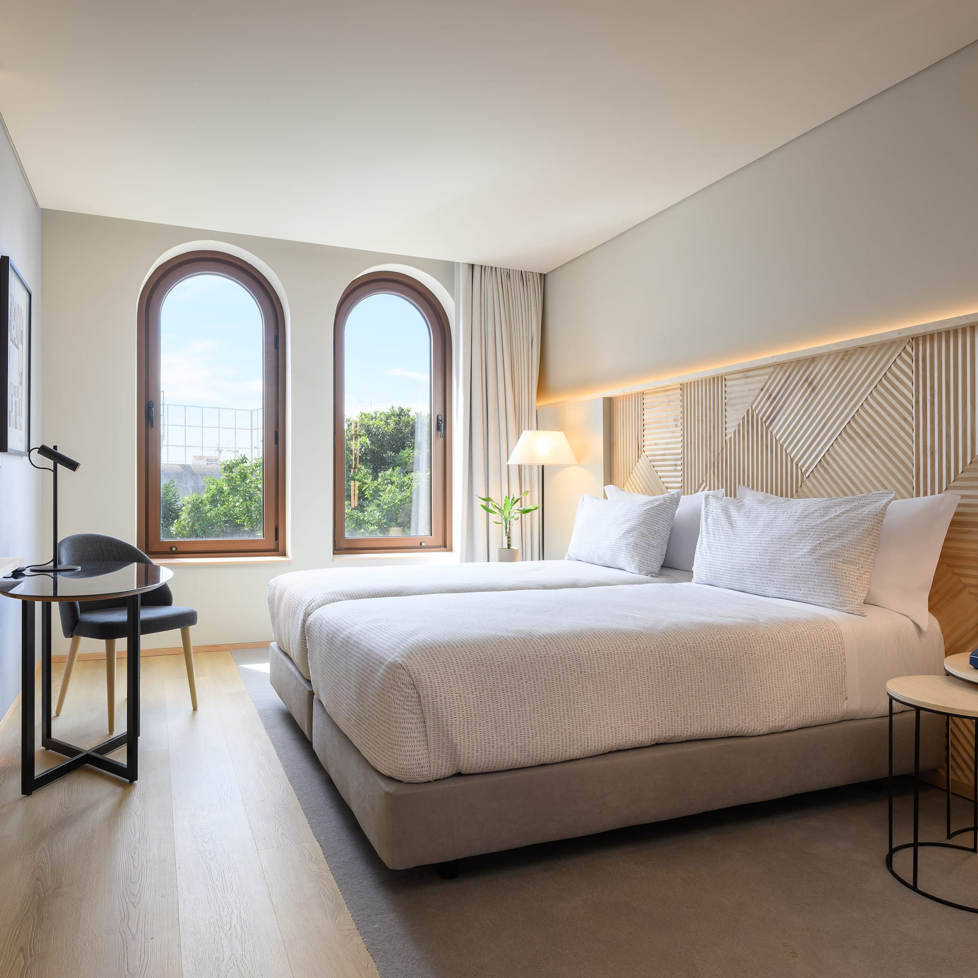 a bedroom with a bed and a table