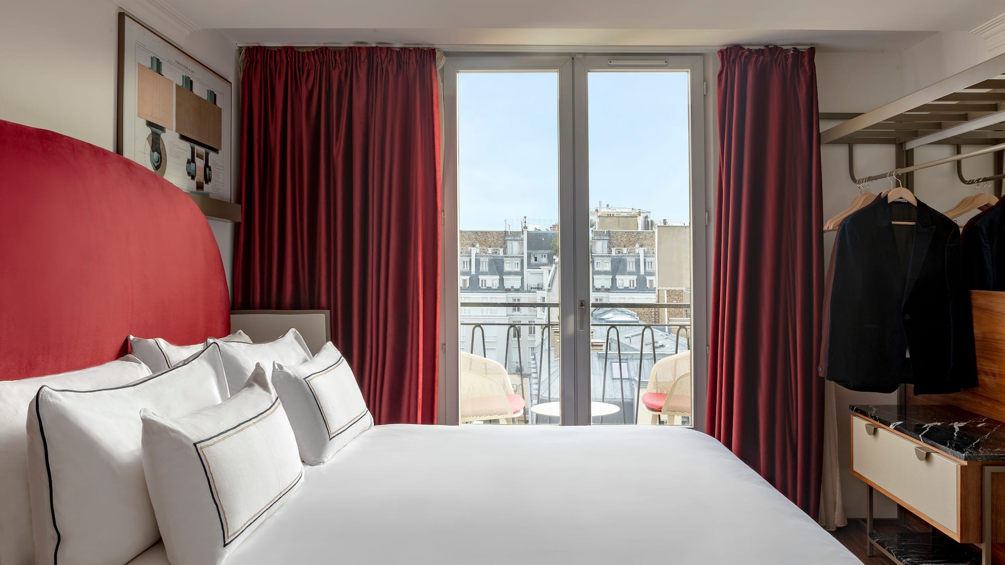 a bed with red curtains and a swinger with a window