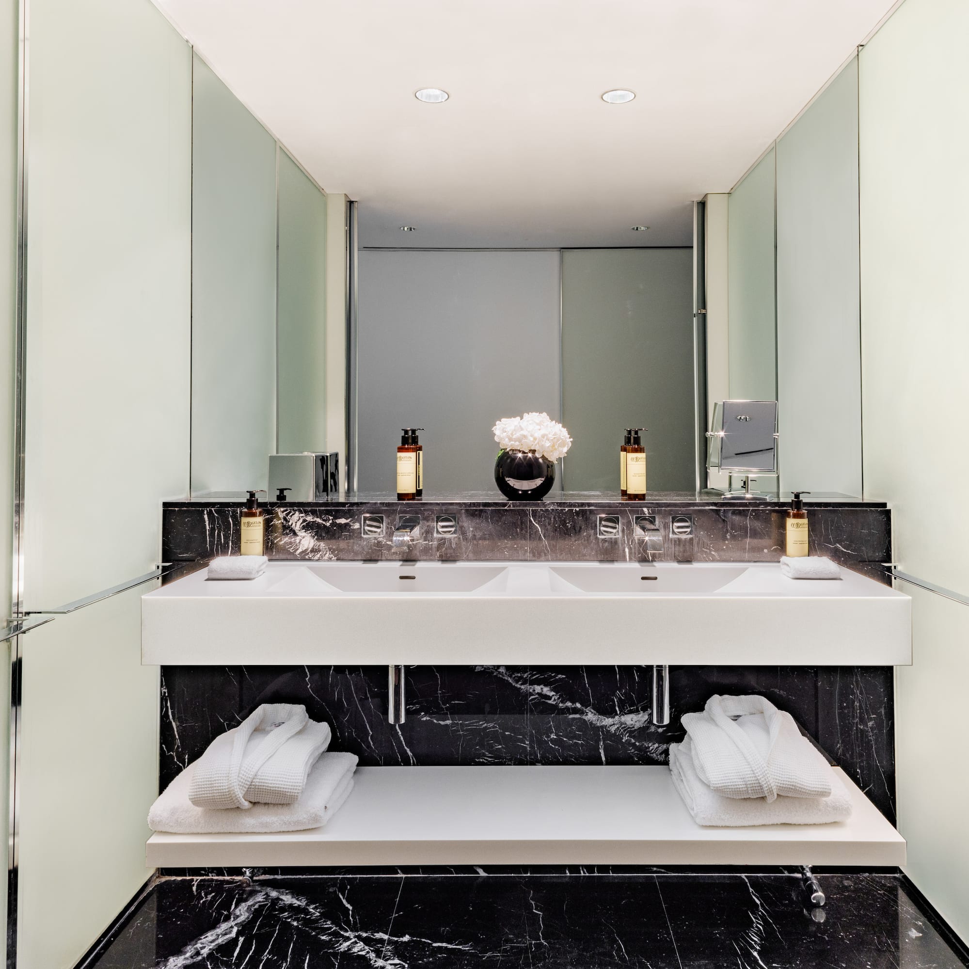 a bathroom with a sink and towels