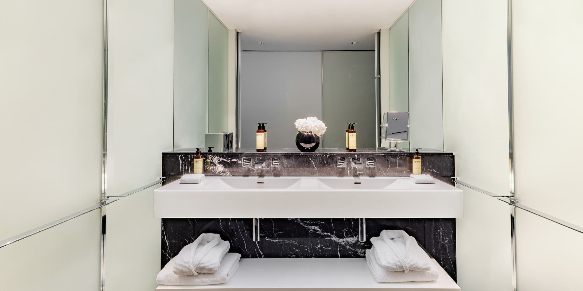 a bathroom with a sink and towels