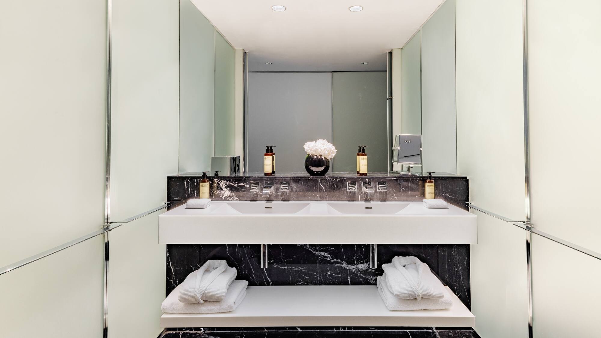 a bathroom with a sink and towels