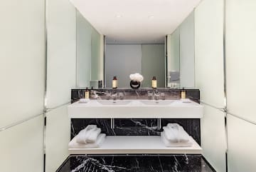 a bathroom with a sink and towels