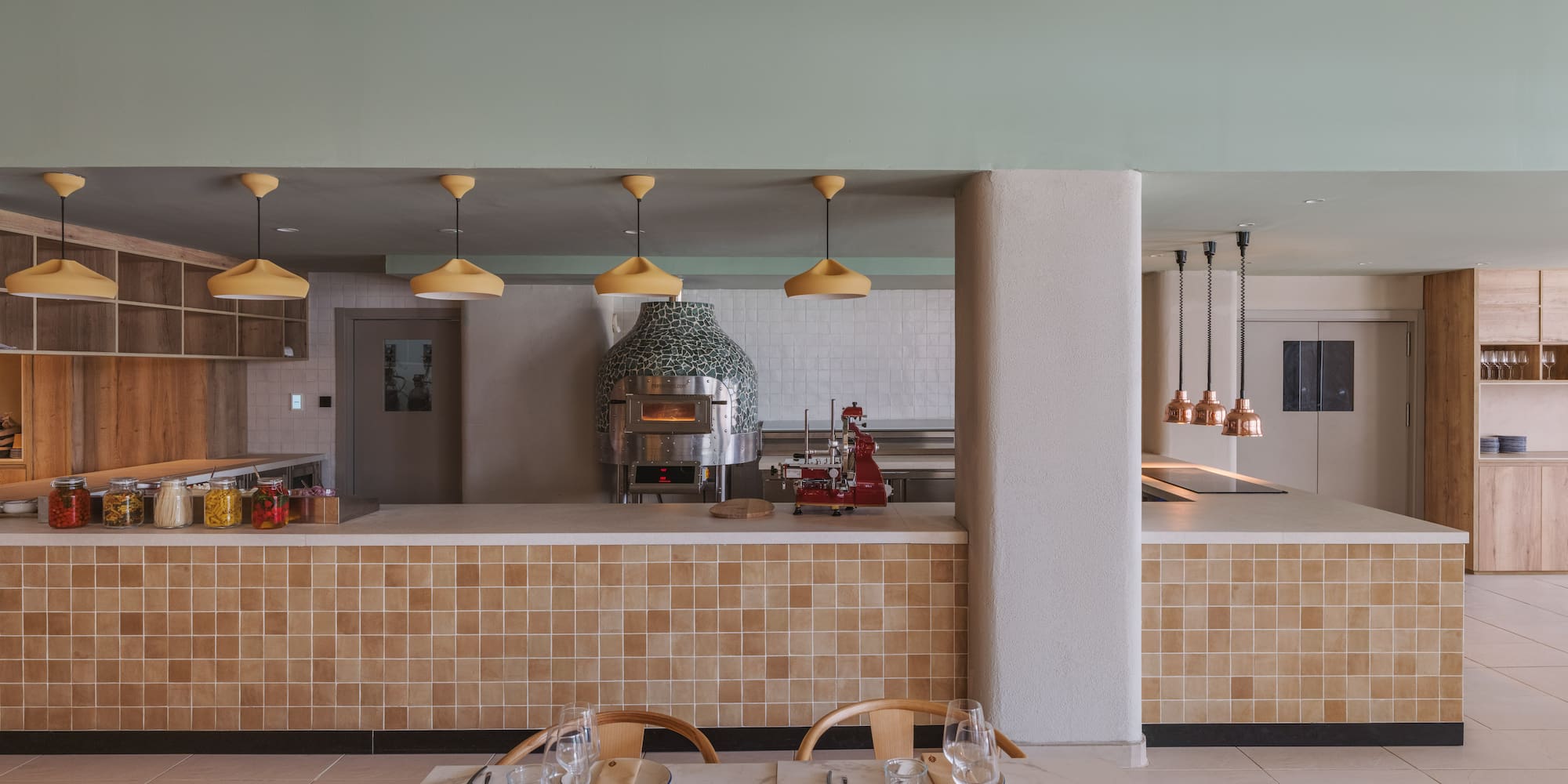 a restaurant with a large counter and a large oven