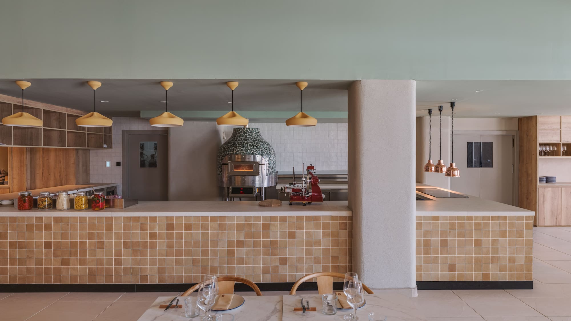 a restaurant with a large counter and a large oven