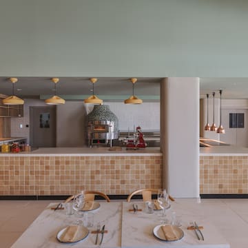 a restaurant with a large counter and a large oven