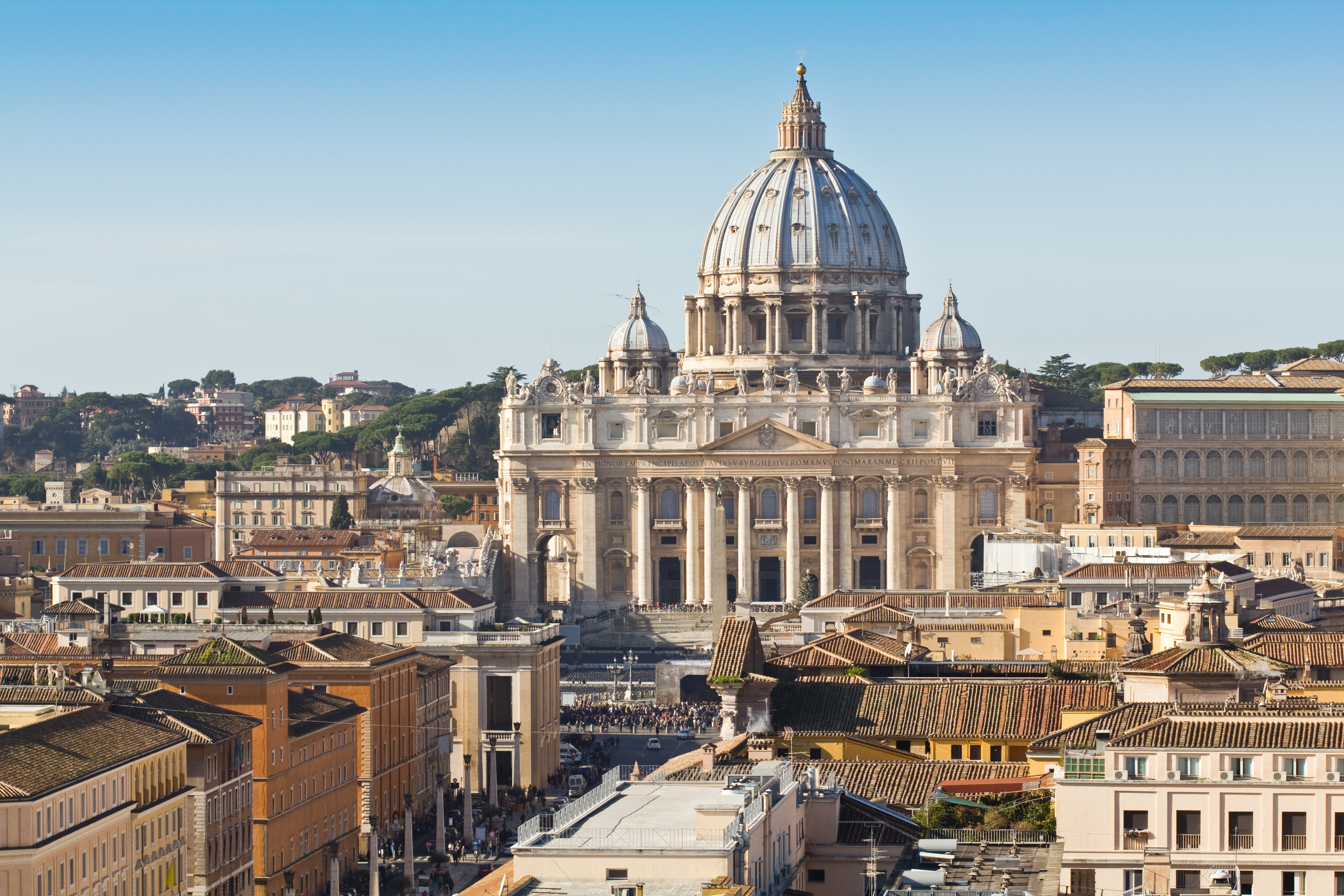 a large building with a dome in the middle of a city