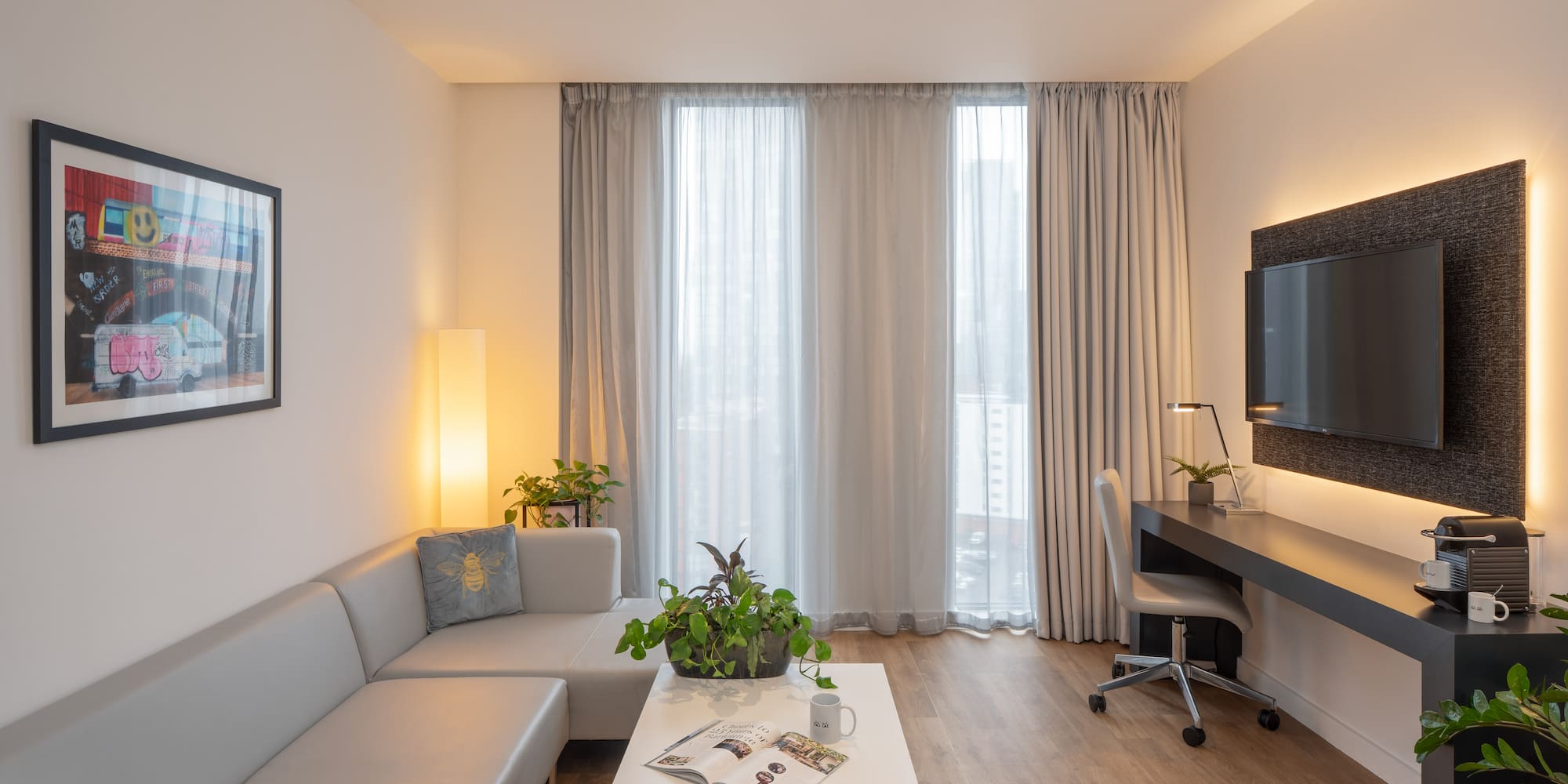 a room with a couch and a desk