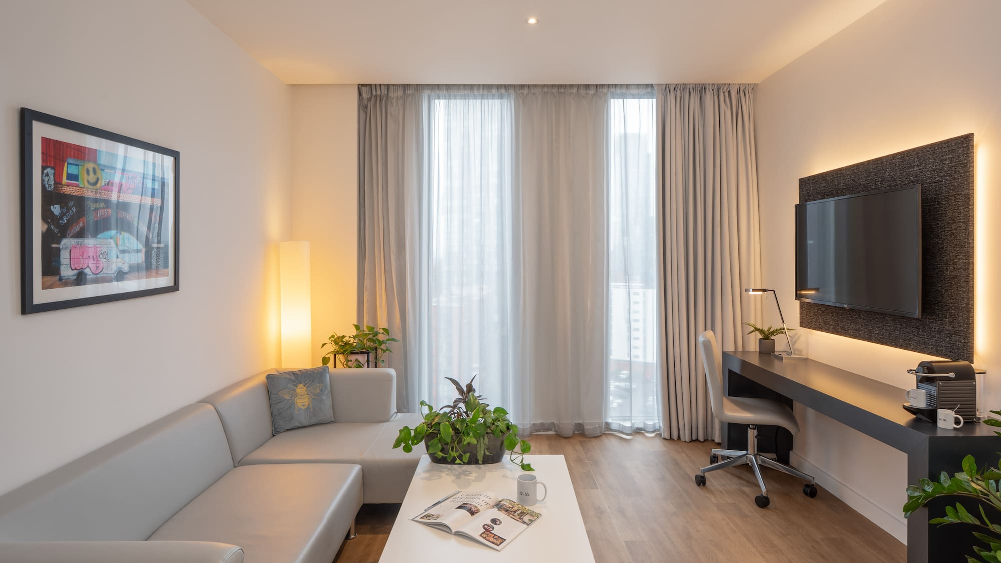 a room with a couch and a desk