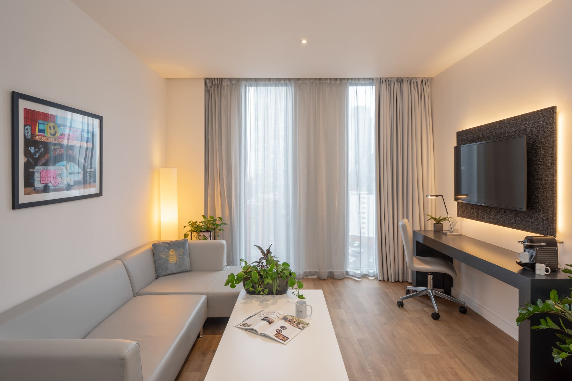 a room with a couch and a desk