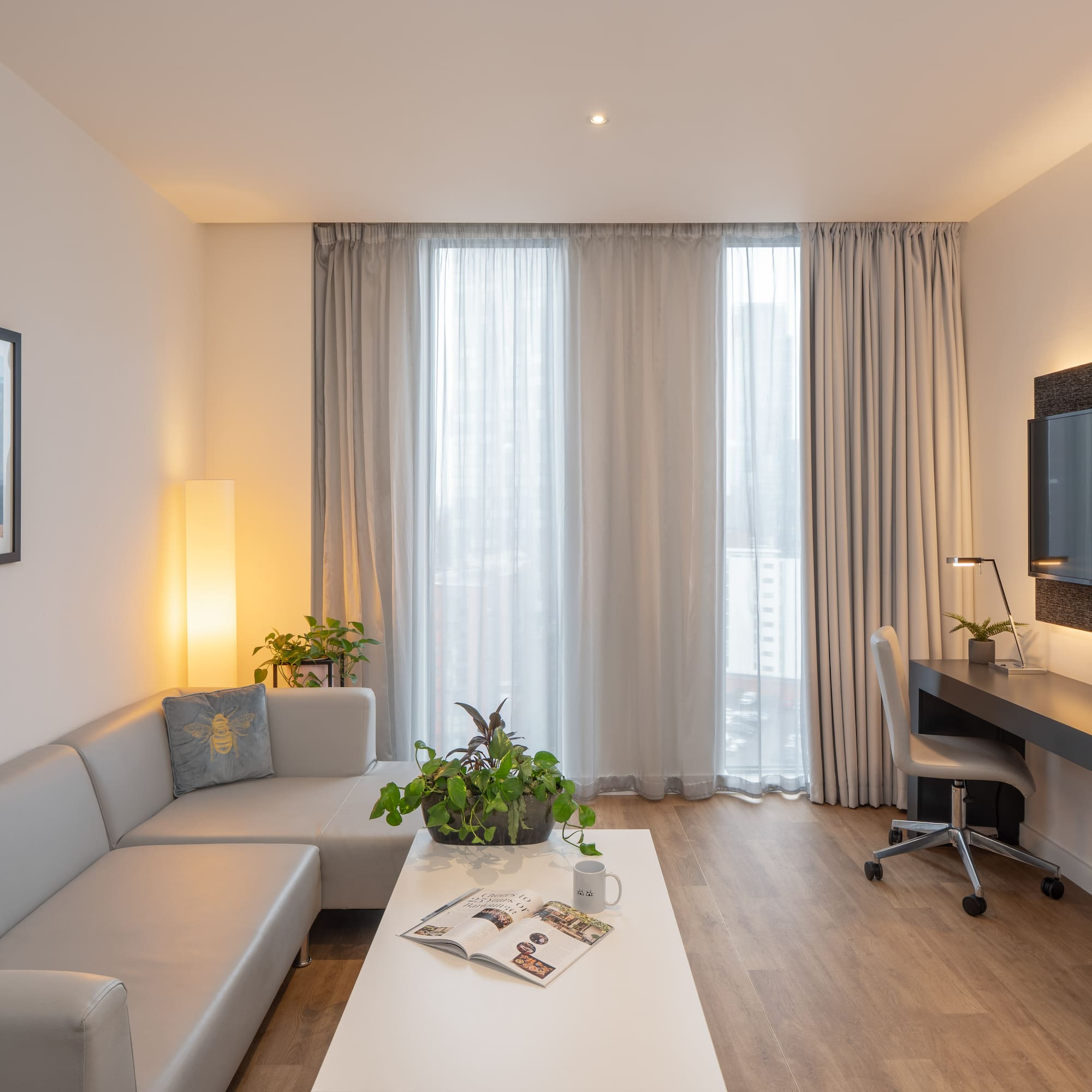 a room with a couch and a desk