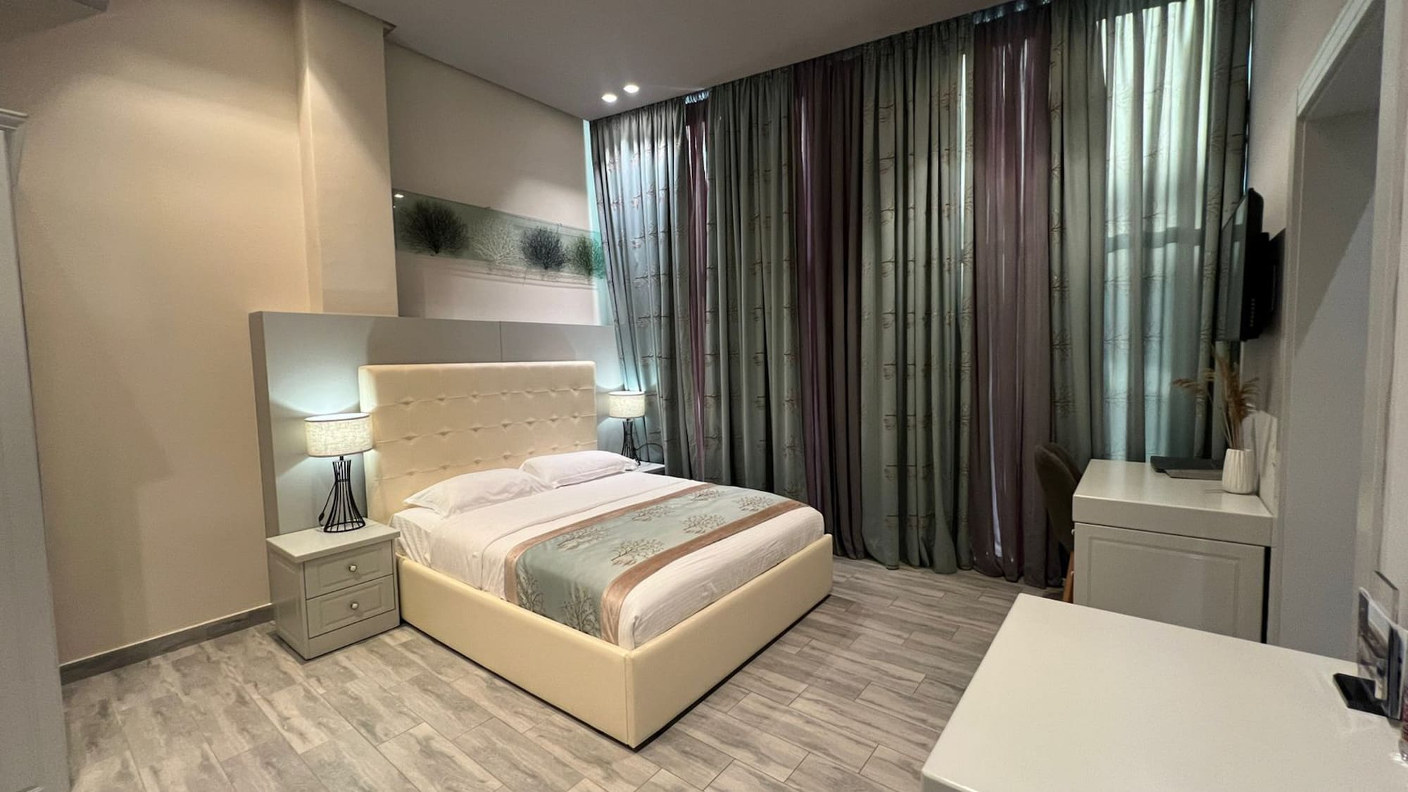 a bedroom with a bed and a desk