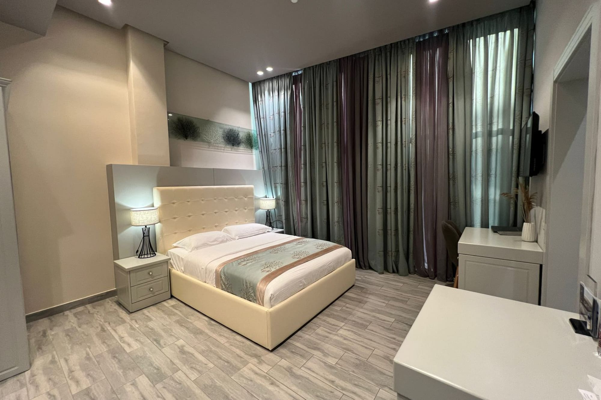 a bedroom with a bed and a desk