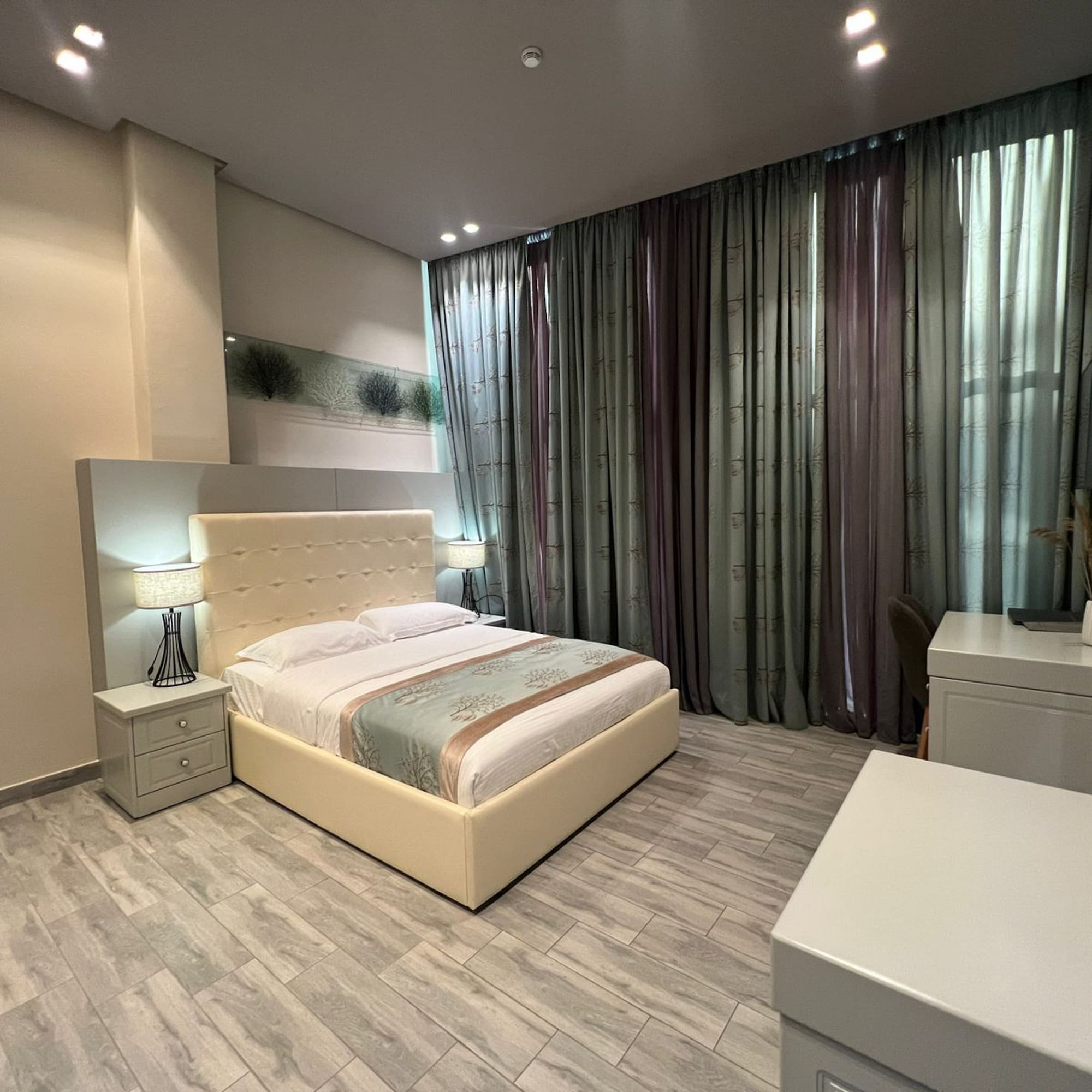 a bedroom with a bed and a desk