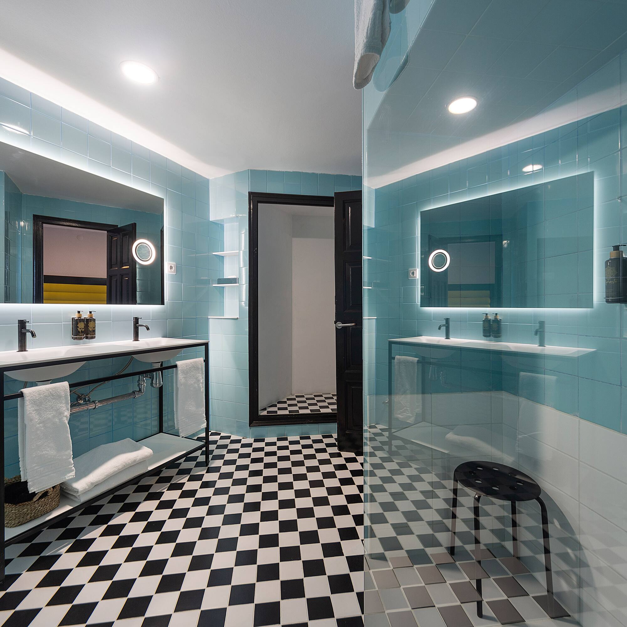 a bathroom with a mirror and a shower