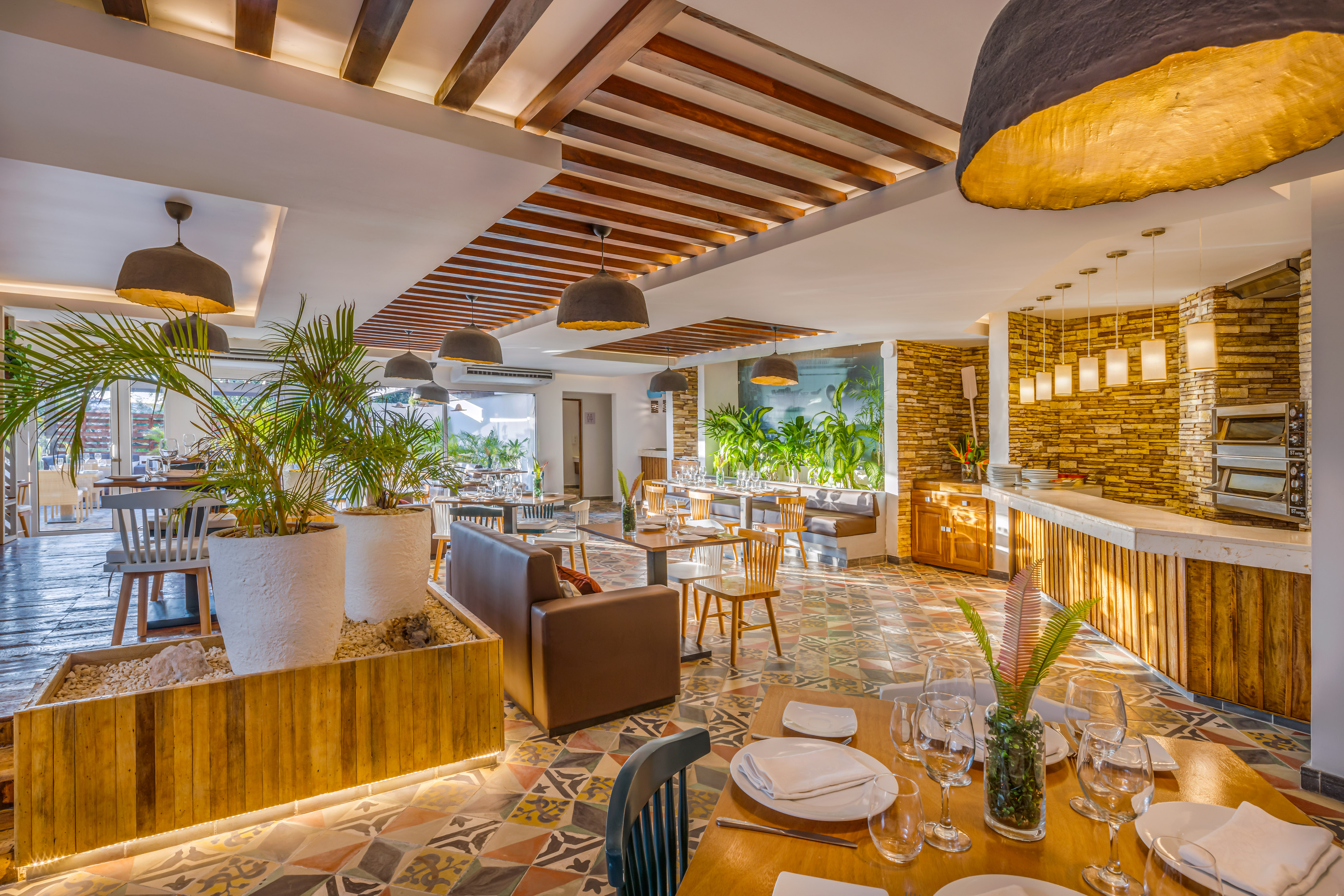 a room with tables and chairs and a bar