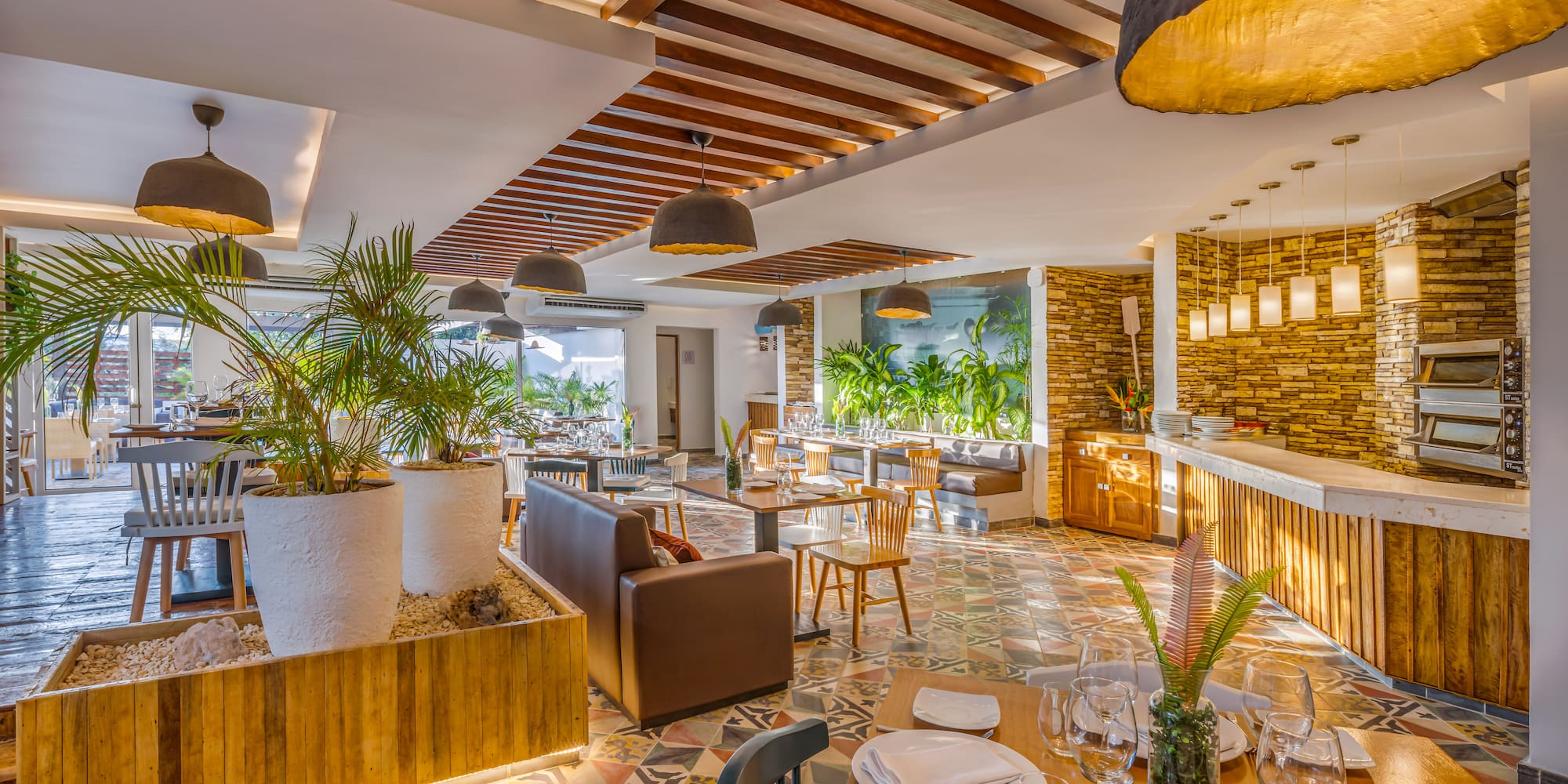 a room with tables and chairs and a bar