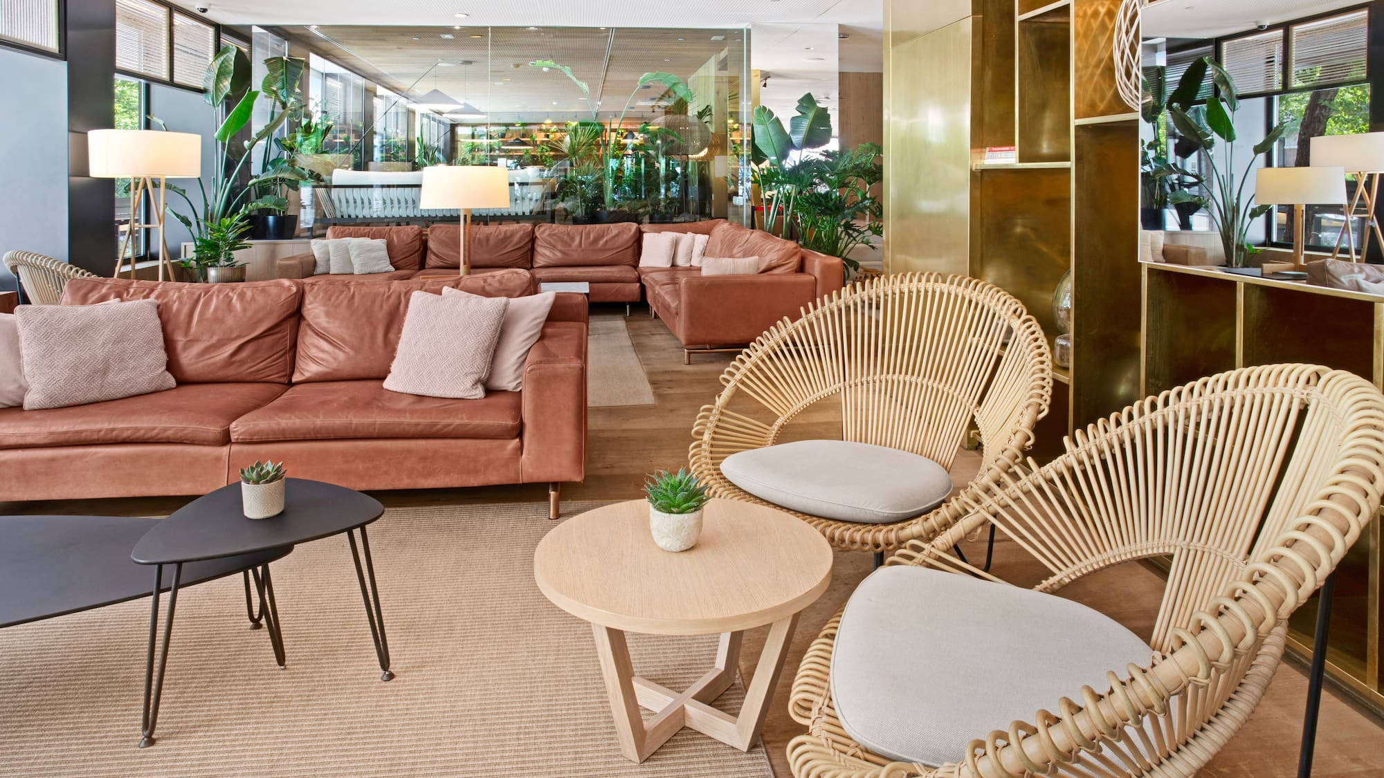 a room with a couch and chairs