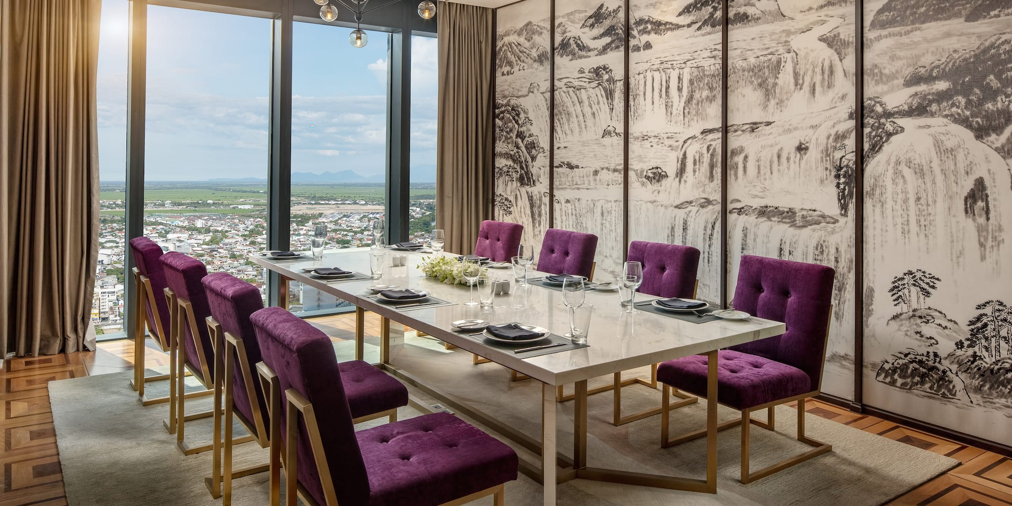a dining room with purple chairs and a table
